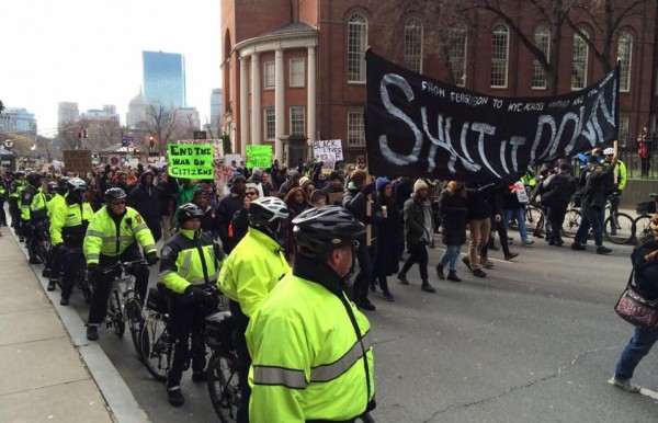 Boston police bicycle patrol lines up astride bicycle at start of protext march.