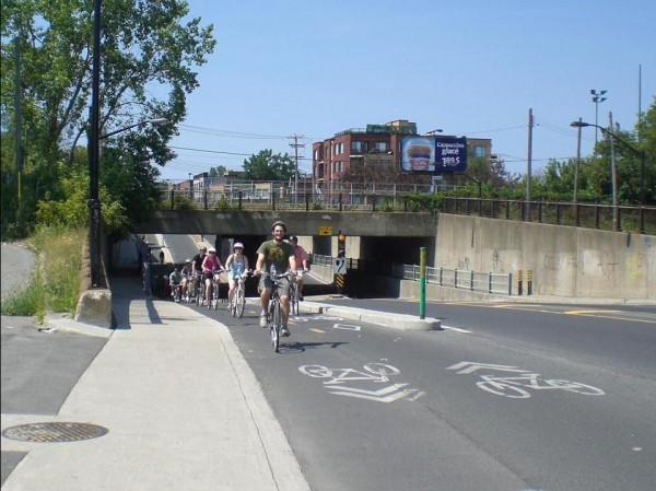 "Cycle tracks are exclusive bicycle facilities that are physically separated from motor vehicle lanes through grade changes, parking lanes, curbs, or landscaping." Photo by Eric Moskowitz for the Boston Globe